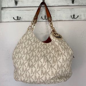 Large Michael kors handbag with matching wallet.